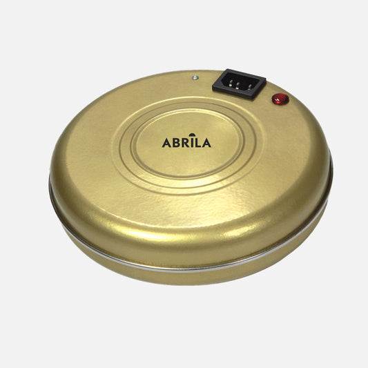 Acumulador de Calor Portátil Fargo 550 W Oro con Funda Fabrilamp instalada en ambiente decorativo de salón o dormitorio | Fabrilamp / Abrila