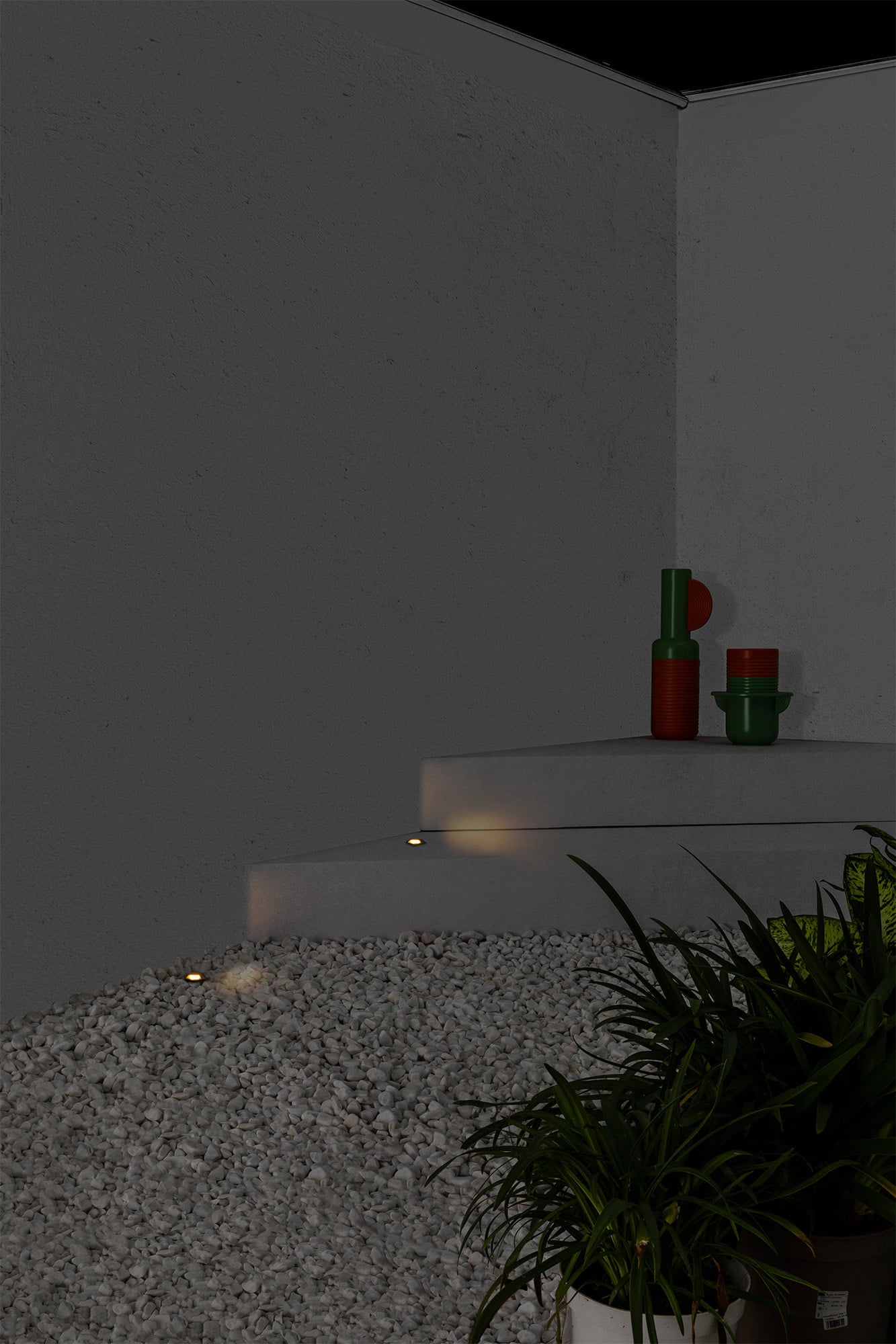 Luz empotrable KANE 3 en níquel 3000K instalada en pared de jardín exterior, luminaria LED FARO IP67 de acero inoxidable, modelo 70662 colección 7069