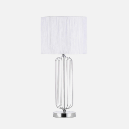 Lámpara de sobremesa Mansonia en cromo y blanco de Abrila, modelo 138071020, con base metálica y pantalla textil para iluminación interior doméstica con casquillo E27, diseño moderno para decoración del hogar.