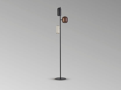 Lámpara de pie I3-Nimes Schuller en negro, marrón y gris, diseño moderno con detalles metálicos. Iluminación interior multicolor ideal para cualquier espacio.