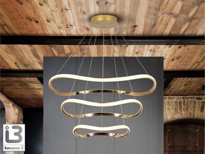 Lámpara de techo Naos 3 aros oro rosa de Schuller (151038) colgando en un salón moderno, con diseño de 3 aros, luz cálida regulable, ideal para iluminación de hogar y dormitorio.