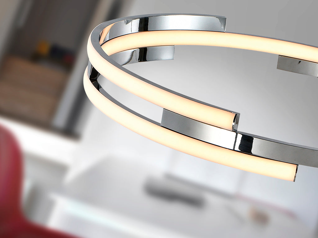 Lámpara colgante Ciclos cromada de diseño moderno para comedor y salón con iluminación LED regulable en altura, fabricada en metal y aluminio por Schuller.