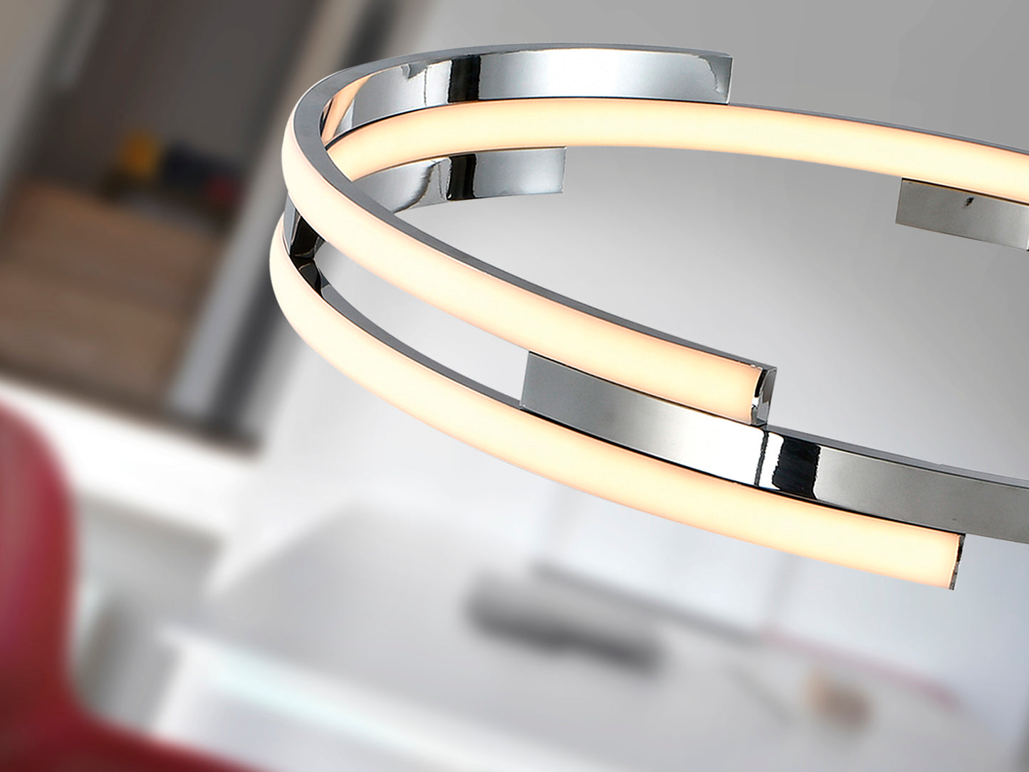 Lámpara colgante Ciclos cromada de diseño moderno para comedor y salón con iluminación LED regulable en altura, fabricada en metal y aluminio por Schuller.