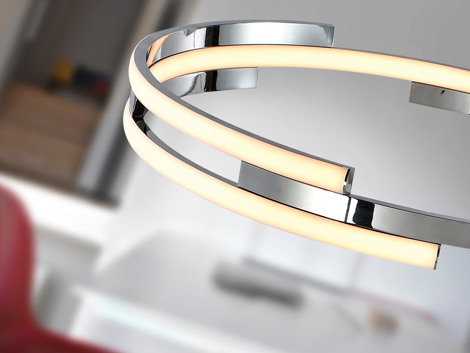 Lámpara colgante Ciclos cromada de diseño moderno para comedor y salón con iluminación LED regulable en altura, fabricada en metal y aluminio por Schuller.