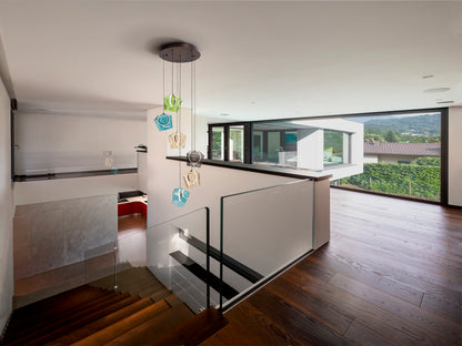 Lámpara colgante Ingrid 6L bronce oscuro Schuller, diseño moderno con cristal de colores y luces LED para iluminación de comedor y salón.