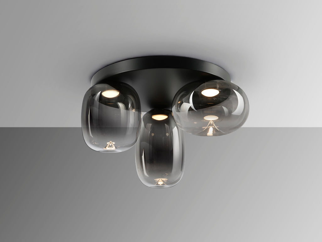 Plafón de techo Onice 3 luces negro y gris smoke, diseño moderno e industrial con LED integrado. Fabricado en metal y cristal, ideal para iluminación elegante. Producto Schuller.
