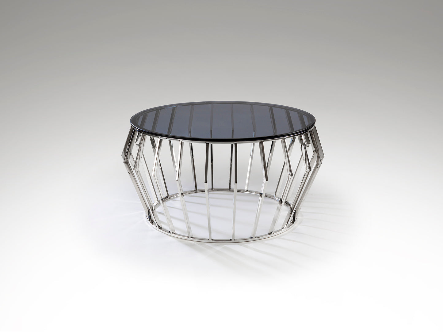 Mesa de centro Ciros de acero inoxidable con acabado pulido brillo y cristal smoke, diseño moderno ideal para salón, marca Schuller.