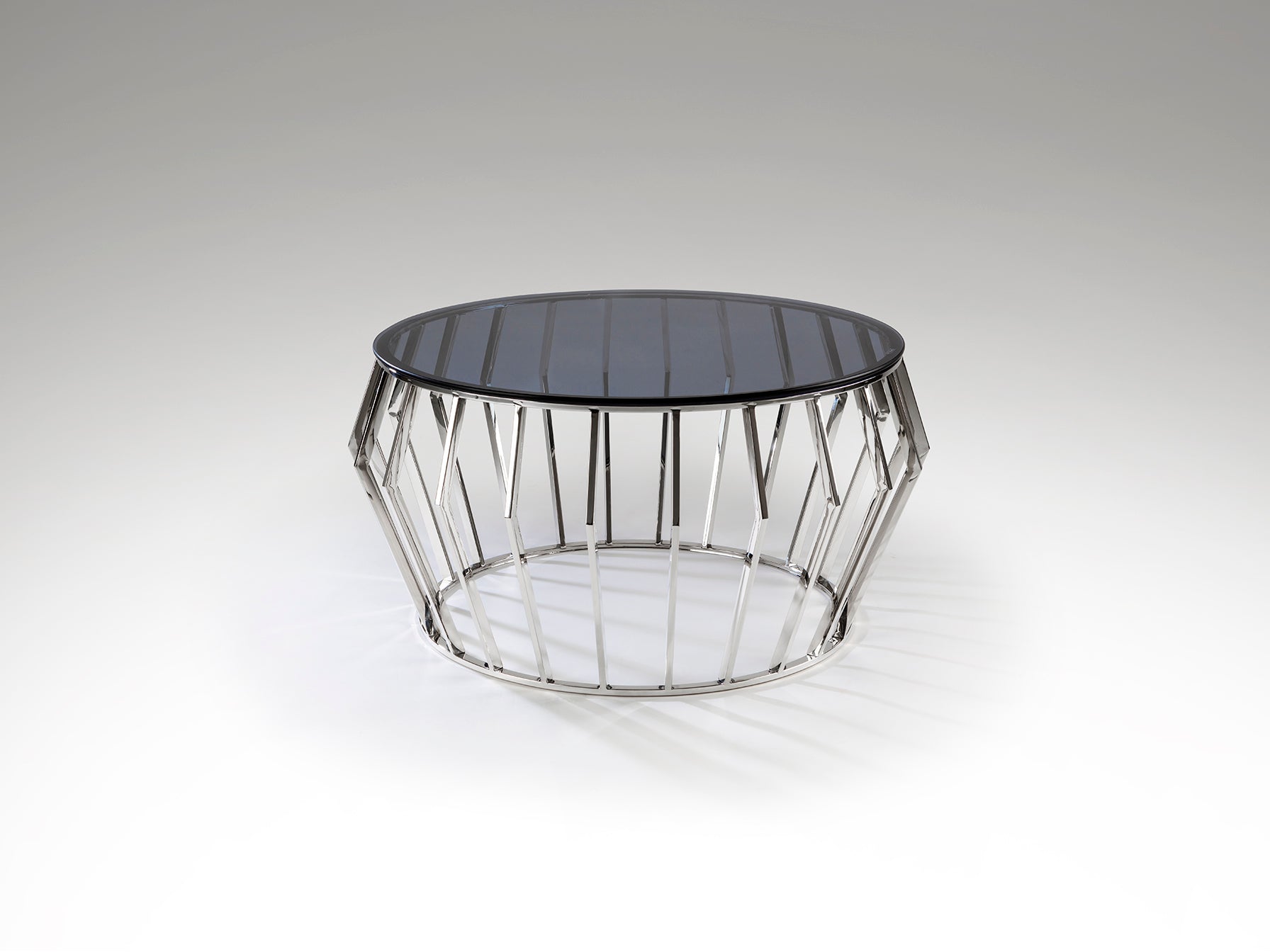 Mesa de centro Ciros de acero inoxidable con acabado pulido brillo y cristal smoke, diseño moderno ideal para salón, marca Schuller.