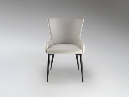 Silla Telma Blanco Hueso Schuller - Diseño moderno para comedor o despacho con estructura de metal negro mate y tapizado textil.