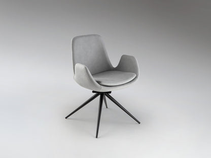 Silla giratoria Zuna gris claro Schuller en comedor moderno, con estructura de metal negro mate y tapizado textil. Ideal como silla de oficina.