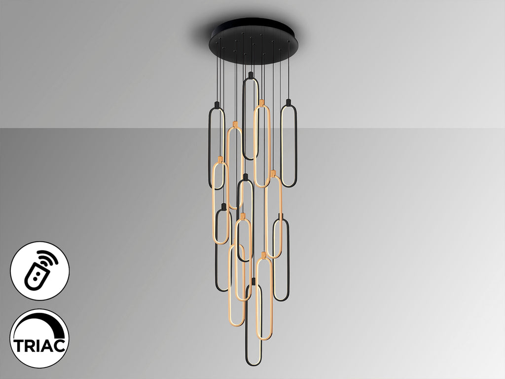 Lámpara de techo COLETTE negra y oro rosa de Schuller iluminando un comedor moderno, con diseño industrial chic, LED, regulable en altura y dimmable. Fabricada en aluminio, silicona y opal. Ideal para salón.