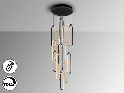 Lámpara de techo COLETTE negra y oro rosa de Schuller iluminando un comedor moderno, con diseño industrial chic, LED, regulable en altura y dimmable. Fabricada en aluminio, silicona y opal. Ideal para salón.