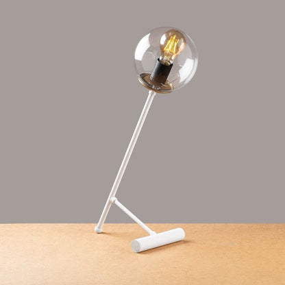 Lámpara de mesa fabricada en metal y cristal, color blanco mate.