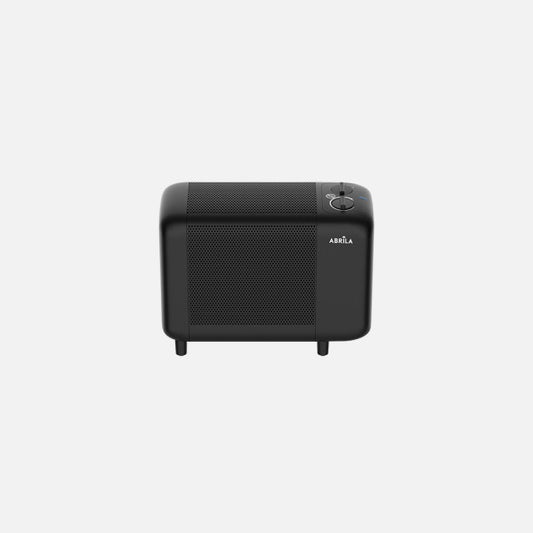 Radiador de Mica Pinsapo 600W Negro Portátil Fabrilamp instalada en ambiente decorativo de salón o dormitorio | Fabrilamp / Abrila