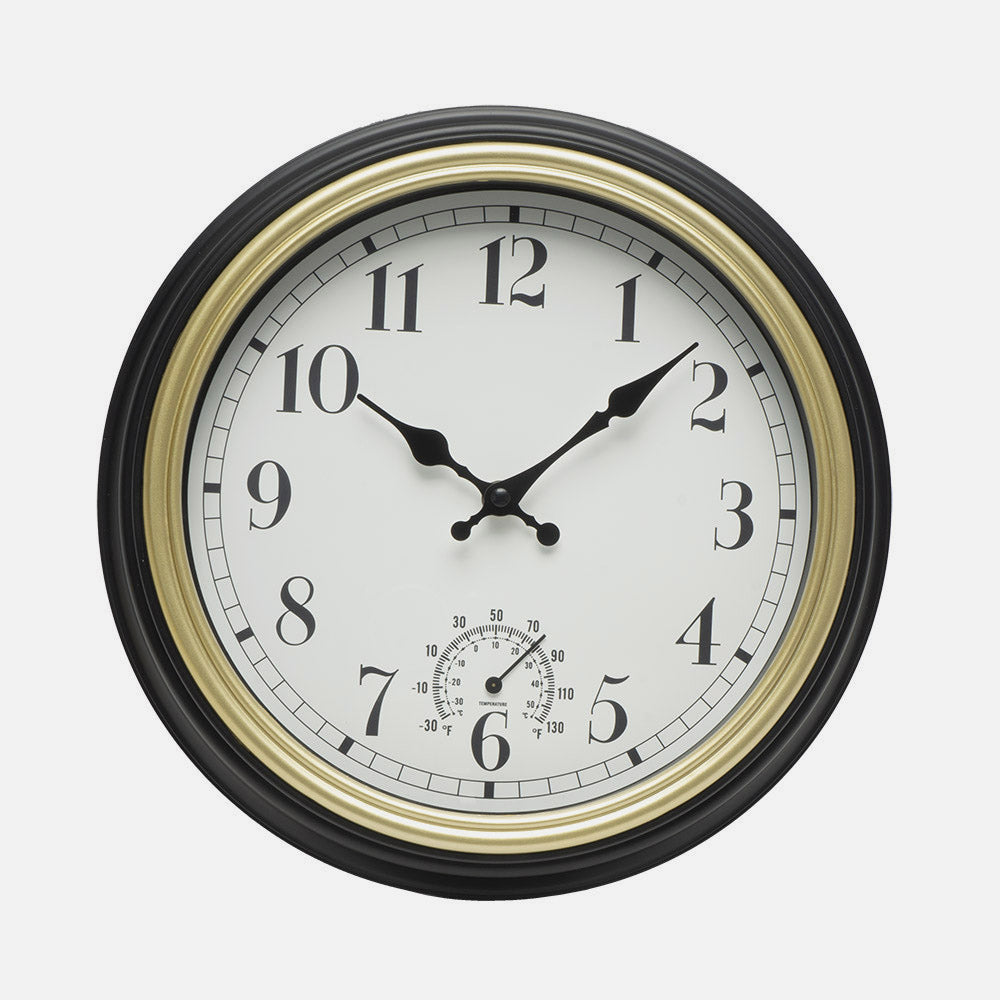 Elegante reloj vintage negro y dorado ideal para el salón